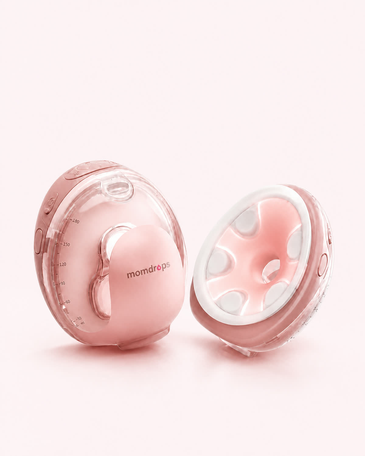 A pair of Momdrops heated wearable breast pumps